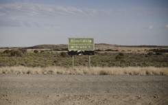 A signpost shows the direction to Orania. AFP/Marco Longari