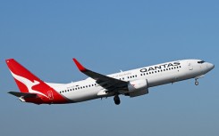 File: A Qantas plane is departing Melbourne Airport. Morgan Hancock/NurPhoto via AFP