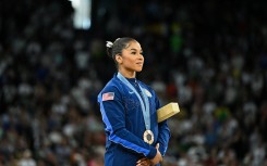 Jordan Chiles poses during the podium ceremony for the artistic gymnastics women's floor exercise event. AFP/Gabriel Bouys