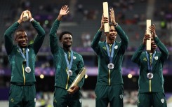 Silver medallists South Africa's Bayanda Walaza, Shaun Maswanganyi, Bradley Nkoana and Akani Simbine celebrate on the podium after competing in the men's 4x100m relay final of the athletics event during the Paris 2024 Olympic Games at Stade de France in Saint-Denis, north of Paris, on August 9, 2024.