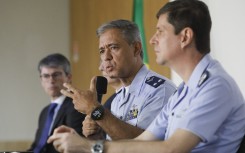 Air Brigadier Marcelo Moreno (C) of the Brazilian Air Force (FAB) and head of the Air Accident Investigation and Prevention Center (CENIPA) speaks next to Colonel and chief of CENIPA, Carlos Henrique Baldin (R), during a press conference about the plane that crashed in Vinhedo, Sao Paulo State, killing 61 people, in Brasilia on August 9, 2024.