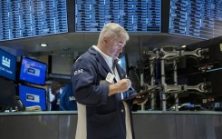 Traders work the floor of the New York Stock Exchange. AFP/Angela Weiss