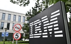 The IBM logo is seen at the entrance to its China System Center building in Beijing. AFP/Pedro Pardo