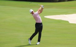 Rory McIlroy of Northern Ireland plays a shot. Kevin C. Cox/Getty Images via AFP