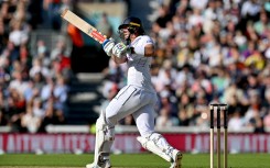England's Jamie Smith watches the ball after playing a shot on day three of the third cricket test match between England and Sri Lanka. AFP/Glyn Kirk