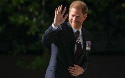 Britain's Prince Harry, Duke of Sussex waves as he arrives to attend a ceremony marking the 10th anniversary of the Invictus Games. AFP/Justin Tallis