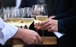 The first batch of wine is handed out to guests at the vineyards of Domaine Evremond in Chilham. AFP/Ben Stansall