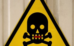 File: An attention toxic poison sign with skull symbol.