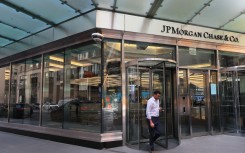 File: People pass the JPMorgan Chase headquarters building in New York City. Michael M Santiago/Getty Images via AFP