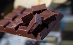 File: Whole and broken chocolate, chocolate bars. Hendrik Schmidt/dpa Picture-Alliance via AFP