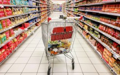 File: A shopping cart in the middle of a section of canned and dried products. Nicolas Guyonnet/Hans Lucas via AFP