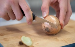 File: A person seen chopping an onion. Sebastian Kahnert/dpa Picture-Alliance via AFP