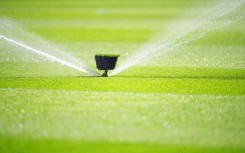 File: A water sprinkler spraying water. Michael Kappeler/dpa Picture-Alliance via AFP