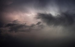 A lightning bolt illuminates the sky. Rami Alsayed/NurPhoto via AFP