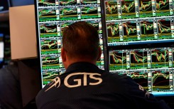 A trader works on the floor at the closing bell t the New York Stock Exchange. AFP/Timothy A Clary