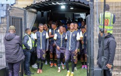 The Royal AM team walking onto the pitch. BackpagePix/Pierre Tostee