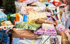 File: Wrapped Christmas gifts. Christoph Soeder/dpa Picture-Alliance via AFP