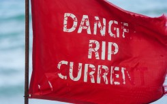 File: A red flag, indicating unsafe swimming conditions and warning for rip current, is seen on a beach. AFP/Jaydee Lee Serrano