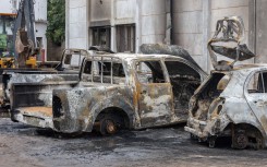 File: A general view of the rubble of three cars that were burned inside the offices of the Mozambique Liberation Front party (FRELIMO) in the Maxaquene neighbourhood of Maputo on November 8, 2024, following clashes between protesters and riot police the previous day. 
