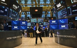 Traders work on the floor of the New York Stock Exchange. AFP/Angela Weiss