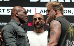 US boxer Mike Tyson (L) and US boxer-actor Jake Paul (R) face each other during a press conference ahead of their heavyweight bout at The Pavilion at Toyota Music Factory in Irving, Texas on November 13, 2024.