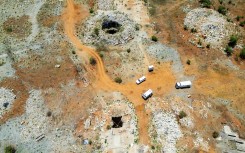 File: This aerial view shows an open mine shaft where artisanal miners get access to the mine in Stilfontein. AFP
