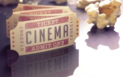 Cinema tickets and popcorn, computer illustration.