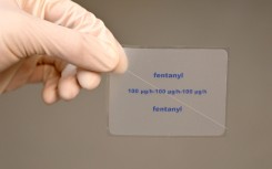 File: A patch containing the active ingredient Fentanyl is shown by a pharmacist. 