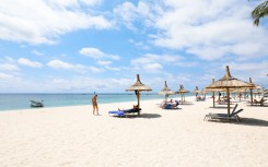 A general view of tourists of the Flic en Flac beach at Hotel Villa Carolina, located on the western coast of Mauritius. AFP/Laura Morosoli