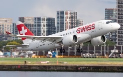 File: A Swiss Airlines Airbus A220 is landing at London City Airport in London. MI News/NurPhoto via AFP