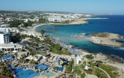 Beachgoers at Nissi Beach in Cyprus' southern coastal resort town of Ayia Napa. AFP/Etienne Torbey
