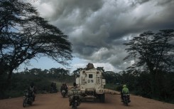 A MONUSCO armed vehicle drives along the Beni-Kasindi Road. AFP/Alexis Huguet