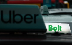 File: Uber and Bolt logos are seen on vehicles. Jakub Porzycki/NurPhoto via AFP