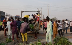 A rescue operation takes place at the petrol tanker explosion in Dikko. next24online/NurPhoto via AFP
