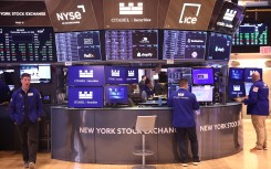 Traders work on the floor of the New York Stock Exchange during morning trading. Michael M. Santiago/Getty Images/AFP