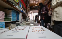 People browse publications at a bookshop in Damascus. AFP/Louai Beshara