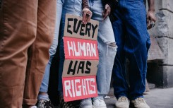 File: Group of people marching for human rights. GettyImages/Leo Patrizi