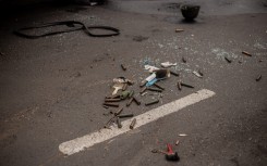 Bullet casings lie on a street as some residents tentatively emerge in Goma. AFP/Jospin Mwisha