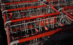 The Costco logo is displayed on shopping carts at a Costco Wholesale warehouse store. AFP/Patrick T Fallon