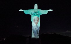 A picture of Pope Francis projected on the Christ the Redeemer statue in Rio de Janeiro, Brazil. AFP/Sanctuary of Christ the Redeemer