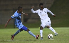 Mcedi Vadala of Mageci FC challenged by Nkosikhona Ndaba of Richards Bay FC. BackpagePix/Sydney Mahlangu