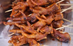 Chicken feet are being displayed at a food stall. Creative Touch Imaging Ltd/NurPhoto via AFP