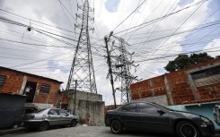 High-voltage towers with irregular electrical connections are seen in Catia. AFP/Pedro Rances Mattey