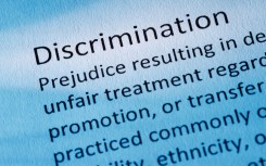 The word discrimination seen in a dictionary. GettyImages/nigelcarse
