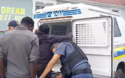 Police officers arresting suspects in Gqeberha.