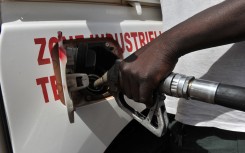 File: A resident fills his car with fuel at a gas station in Bamako. AFP/Issouf Sanogo