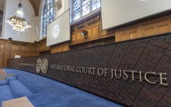 The International Court of Justice logo and inscription. STR/NurPhoto via AFP