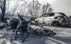 Cars and a motorbike were burnt out at Sivermine dam parking area during a raging fire at Table Mountain National Park. Gallo Images/Brenton Geach