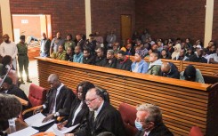 The 11 accused in the multi-million rand Sassa fraud scheme appears at the Lenasia magistrate’s court. Gallo Images/Fani Mahuntsi