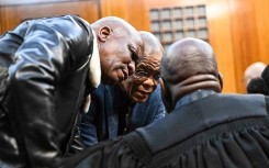 Ace Magashule speaks to a legal representative at Bloemfontein High Court. Mlungisi Louw/Volksblad/Gallo Images via Getty Images